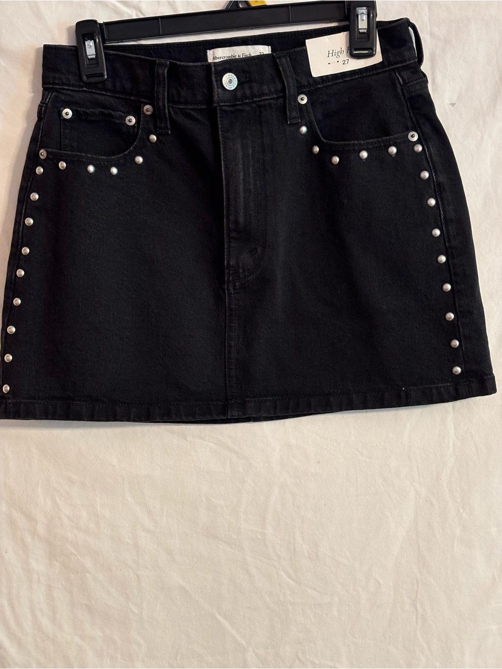 Abercrombie and Fitch black denim miniskirt with studded detail along the front